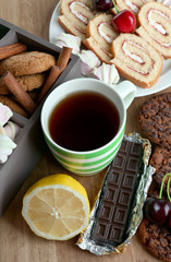 Cup of tea and sweets close up
