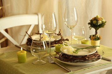 Beautiful holiday Easter table setting in green tones,