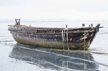 Old fishing boat on rainny day