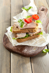 Delicious sandwiches with meet on table close-up