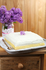 Delicious dessert with lilac flowers