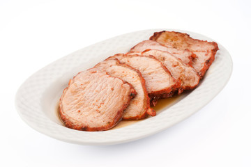 freshly cooked loin steaks marinated in porcelain tray