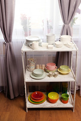 Different tableware on shelf in the interior