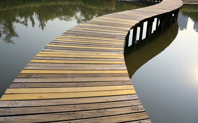 wooden bridge cross the prond