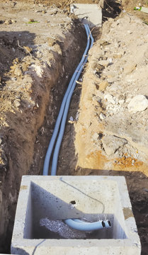 Corrugated pipes underground to connect two inspection wells