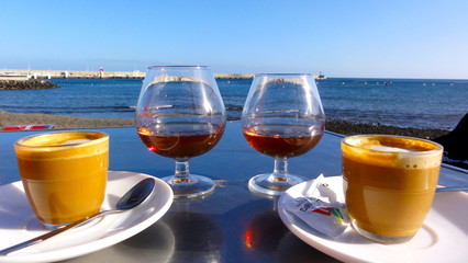 coffee and brandy in the afternoon by the sea