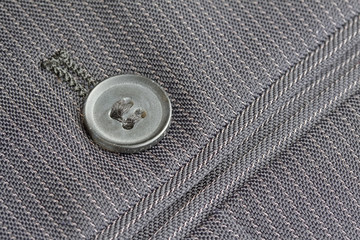 Close up pocket button on formal suit trousers