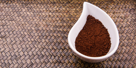 Instant coffee powder in ceramic container 