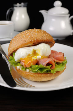 Burger with salmon and poached egg