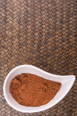 Cocoa powder for making drinks in a white ceramic