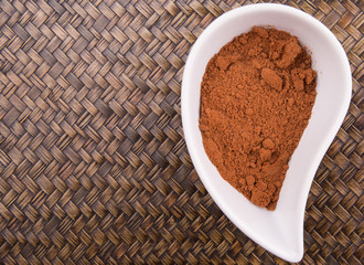 Cocoa powder for making drinks in a white ceramic