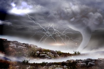 Stormy sky with tornado over landscape