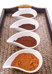 Cocoa powder, dried tea leaves and grounded coffee