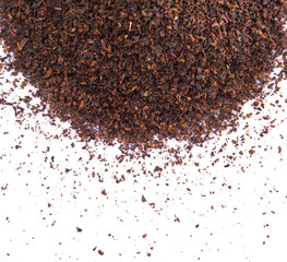 Dried tea leaves over white background