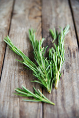 fresh rosemary bunch on an old rustic wooden table