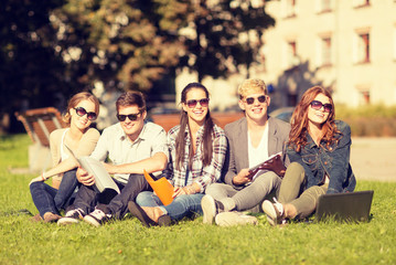 students or teenagers with laptop computers