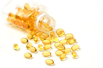  vitamin capsules with  E poured out of bottle