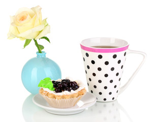 sweet cake with cup of tea isolated on white
