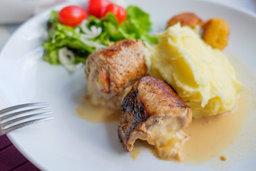 Beef roulade with mashed potatoes and vegetables