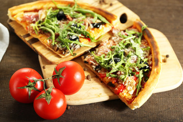 Piece of pizza with arugula