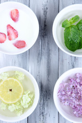 Aromatherapy treatment bowls with flowers and perfumed water