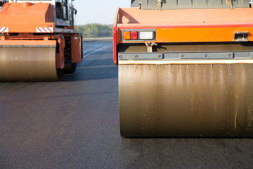 Road rollers during asphalt compaction works