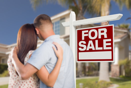 For Sale Real Estate Sign, Military Couple Looking at House