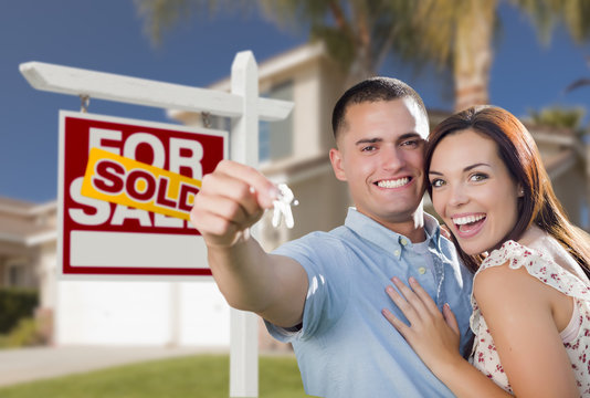 Military Couple In Front of Home, House Keys and Sign - Powered by Adobe
