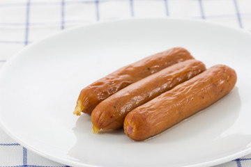 smoked sausage on the white plate