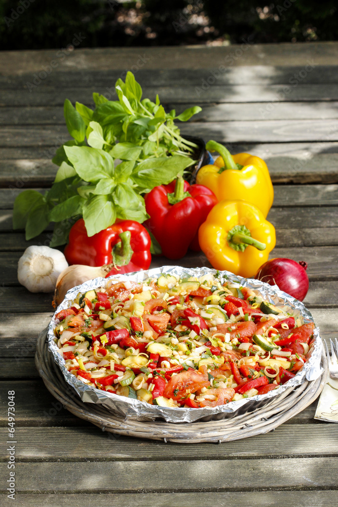 Canvas Prints vegetable tart on rustic wooden table in the garden.