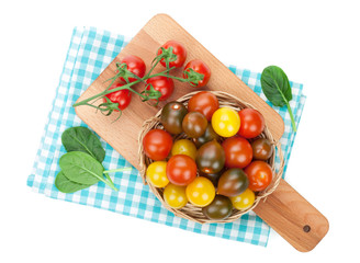 Colorful cherry tomatoes on cutting board