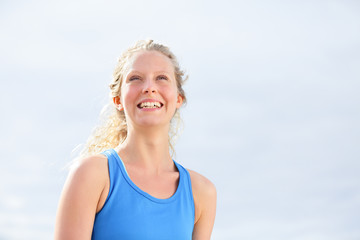 Smiling happy healthy woman outdoor portrait