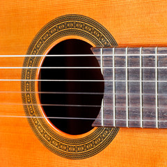 Obraz premium fretboard and sound hole of acoustic guitar