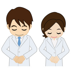 お辞儀する白衣の男女