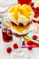 Layer fruit desserts on wooden tray. Summer garden party