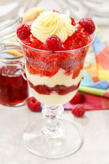 Layer fruit desserts on wooden tray. Summer garden party