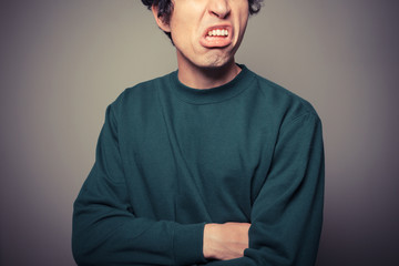 Young man pulling silly faces