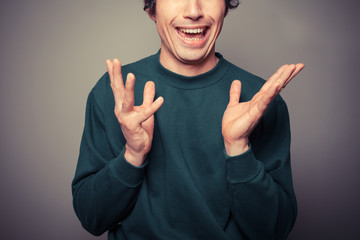 Young man pulling silly faces