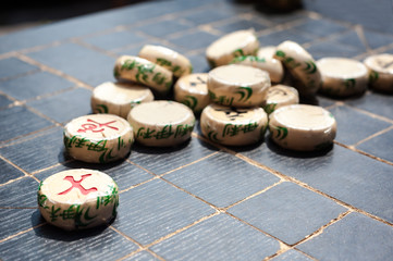 Xiangqi pieces on a Chinese chess board