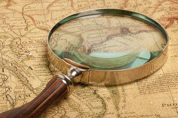 Magnifying glass and  map