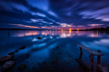 Long time exposure landscape with lake after sunset