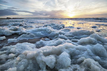 Sea foam on the coast of North Sea