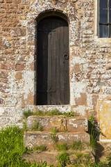 Fototapeta na wymiar Side door, St Mary's church, Upton Hellions, Devon, England.