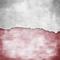 riped vintage paper on grunge background