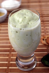 Avocado smoothie made with yogurt, milk and honey