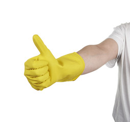 hand with yellow cleaning product glove showing thumb up