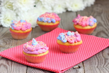 Bright colored muffins with flowers