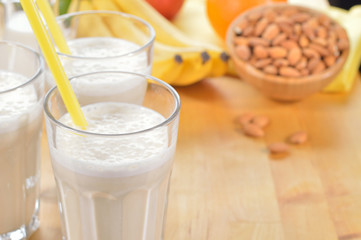 Banana and almond milk smoothie on a table.