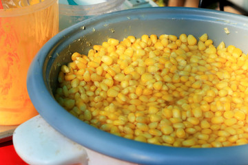 Sweet corn boiled in a pot