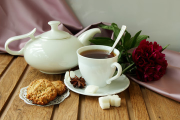 Still life with oatmeal cookies and tea service.